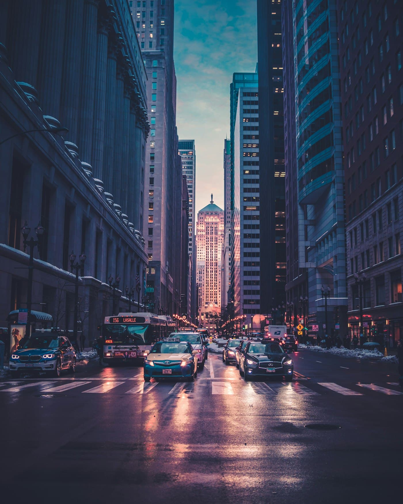 A busy New York City street framed by tall buildings